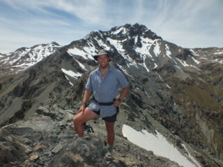 A man on a mountain in summer